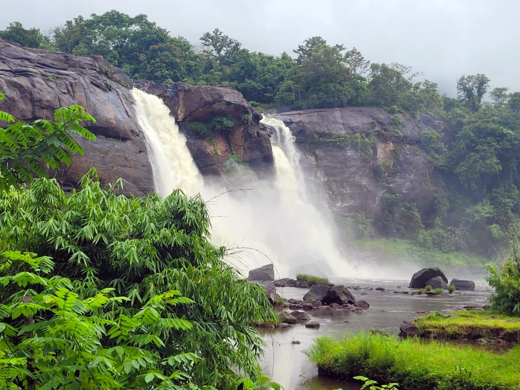 Athirappally Falls cascading through the lush forests of the Western Ghats in Thrissur district, Kerala, one of India's most spectacular waterfalls.