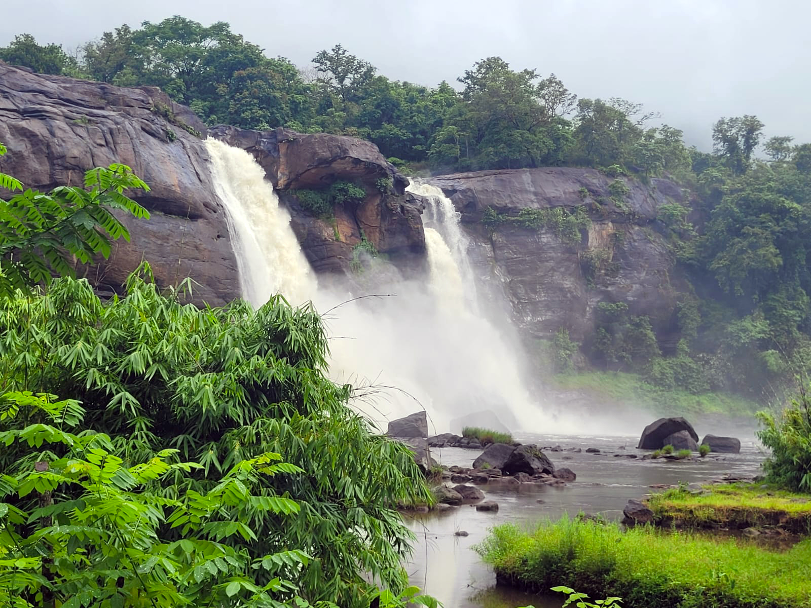 Athirappally Falls cascading through the lush forests of the Western Ghats in Thrissur district, Kerala, one of India's most spectacular waterfalls.
