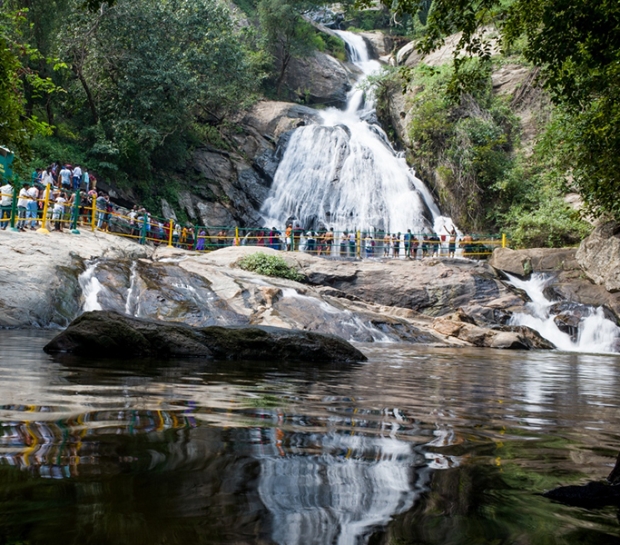 Monkey Falls (Kavi Aruvi) cascading through the lush Anamalai Hills on the scenic Aliyar–Valparai ghat road near Pollachi, Tamil Nadu.